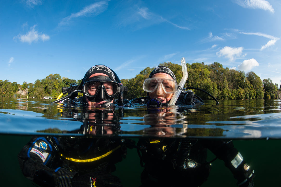 Two divers at the surface, ready to explore